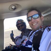 Luke and Andy Farrington in a helicopter preparing for a demonstration jump.