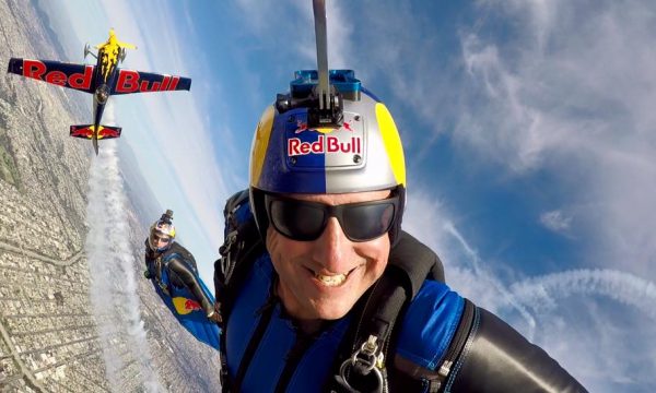 Luke Aikins grins while flying his wingsuit.