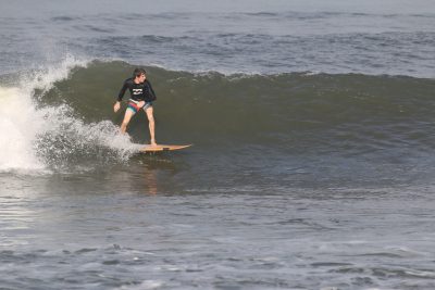 James surfing a wave.