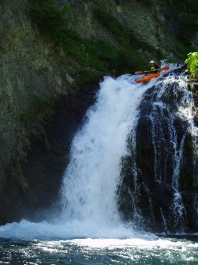 James kayaking down a waterfall.