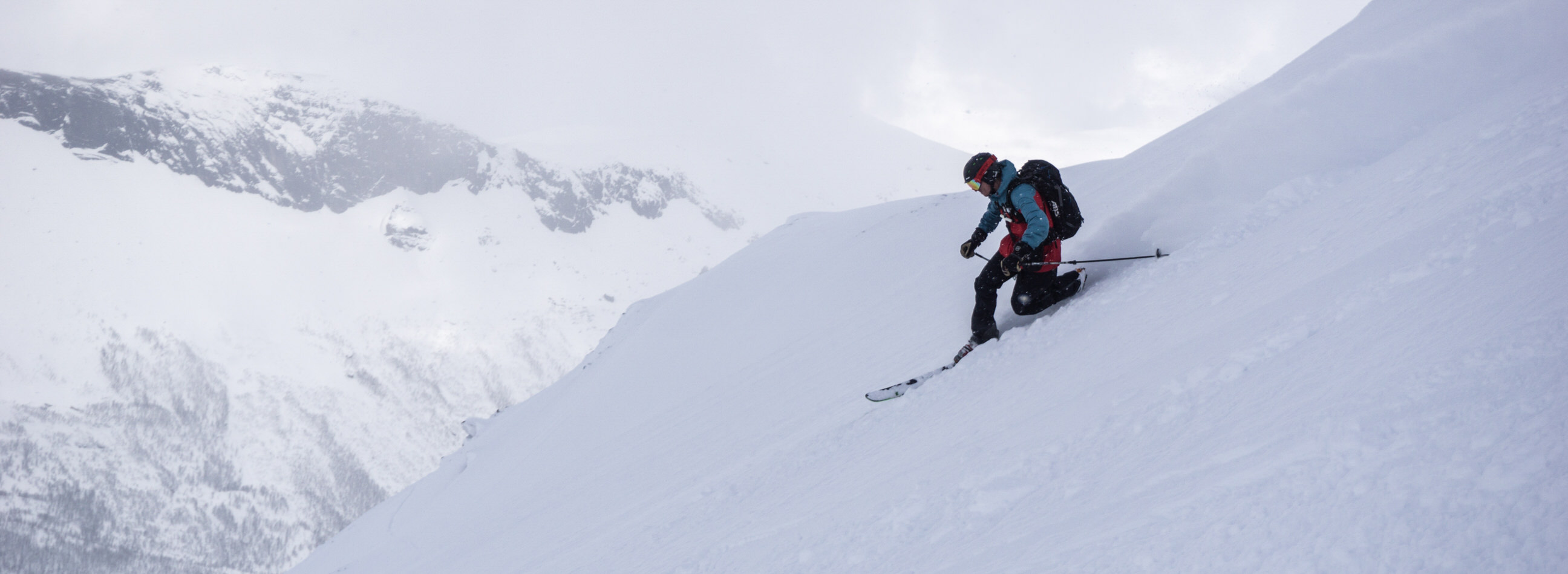 Snow Skiing down a mountain.