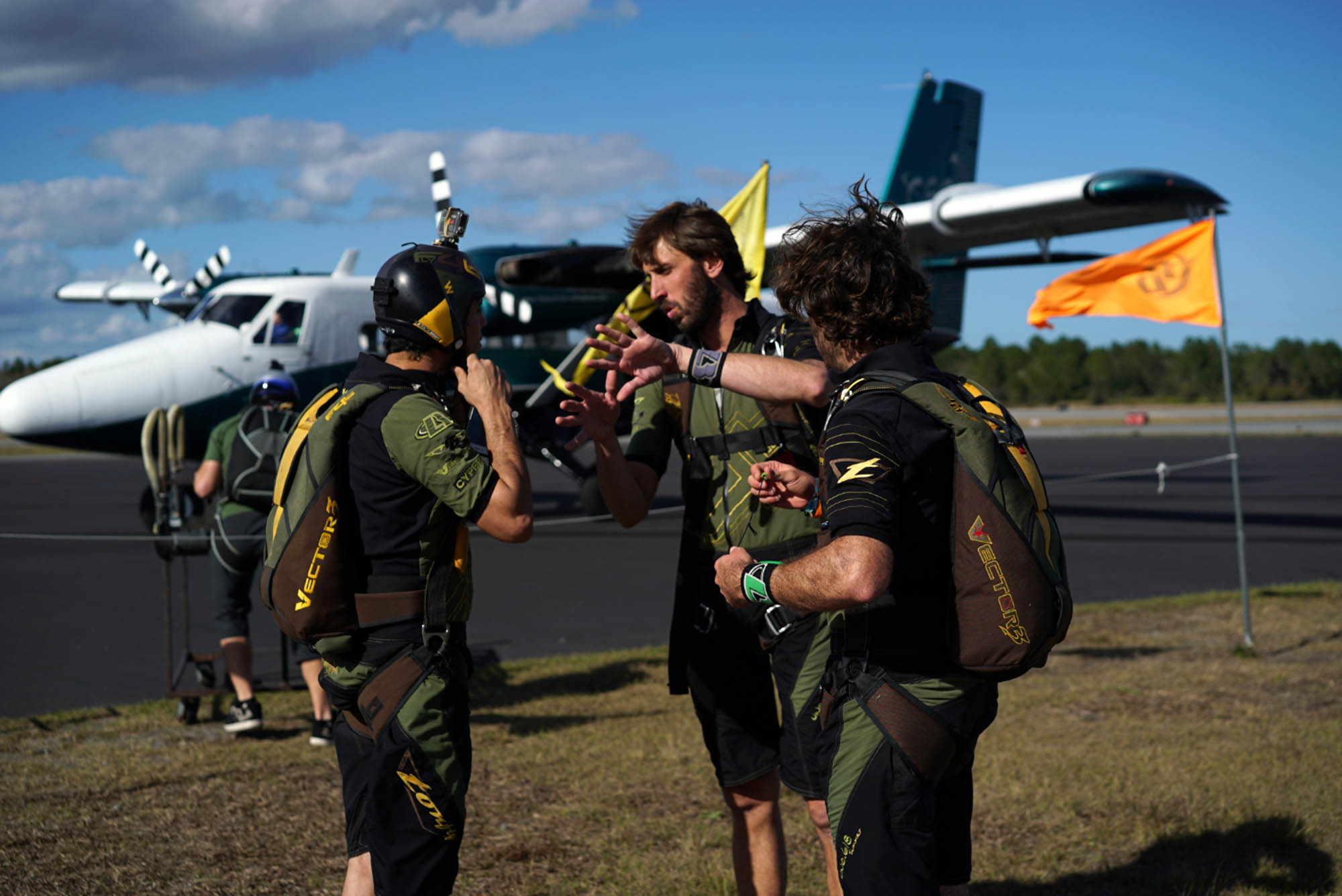 Three of the guys from Fly4Life talk before boarding the plane. 