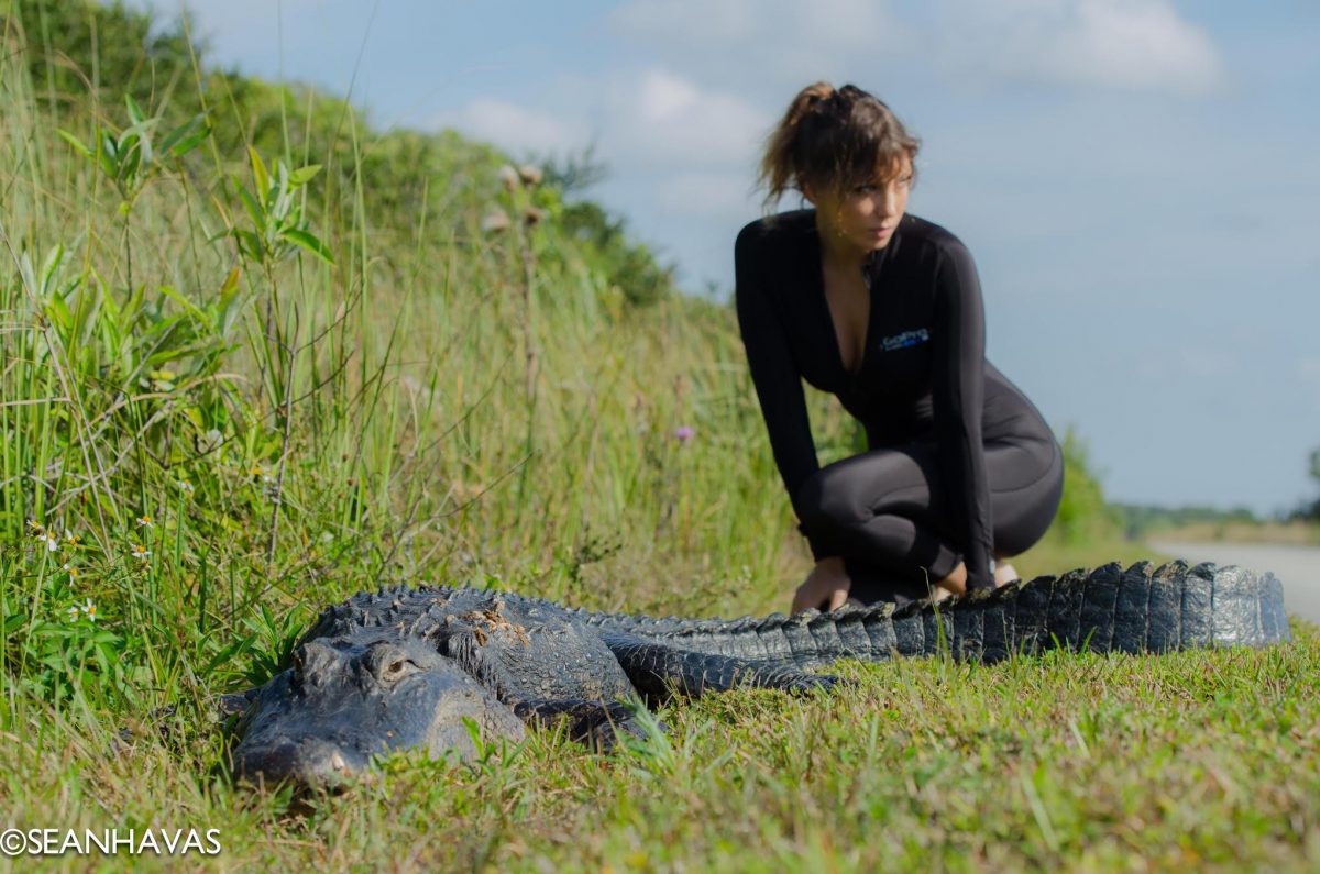 Roberta poses with an alligator