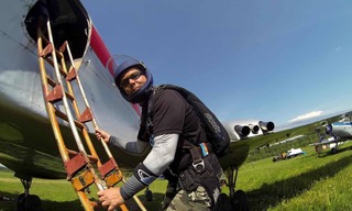 Marcus climbing a ladder to board a plane.