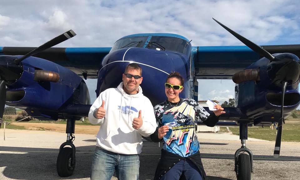 Marcus poses with one of his students in front of a Dornier aircraft at Skydive Spain.