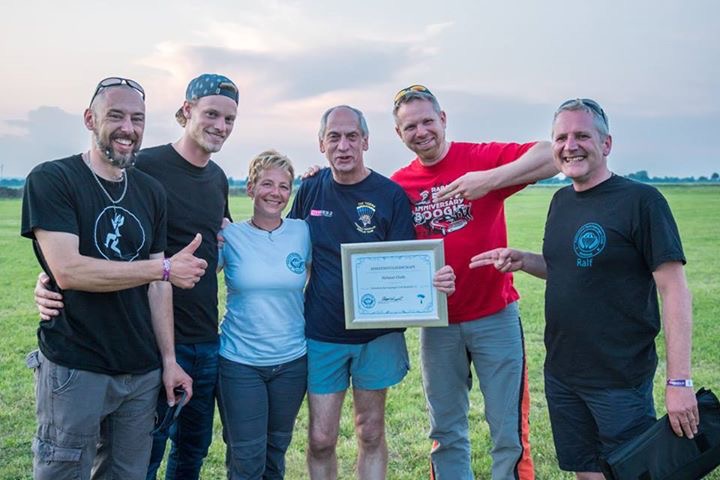 Jacky & Friends with Helmut Cloth at the CYPRES 25 years anniversary Boogie, making him a honorary member of the FSC Bielefeld skydiving club; Photo by Norman Kent.