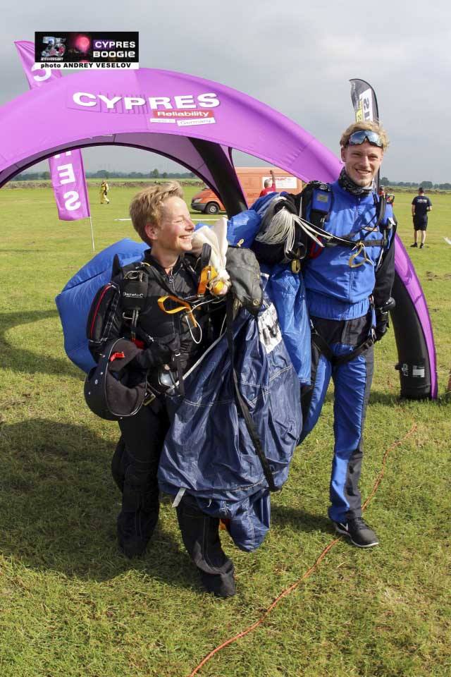 Jacky and a friend walking off the landing aerea after a joyful jump at the CYPRES 25th Anniversary Boogie