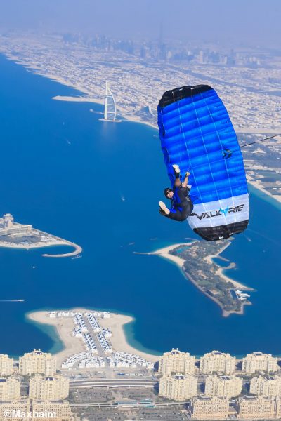 Pablo swings under his canopy above the city of Dubai