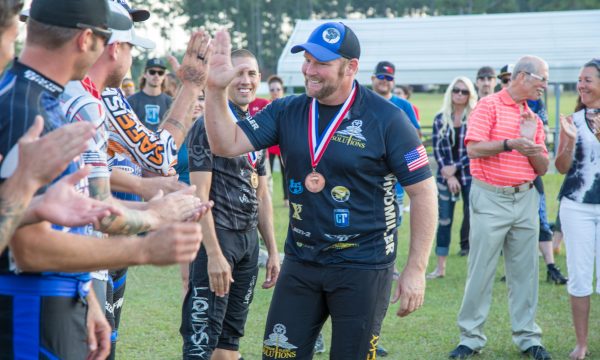 Greg Windmiller gives a high five to his students and fellow competitors following the US Nationals of Canopy Piloting