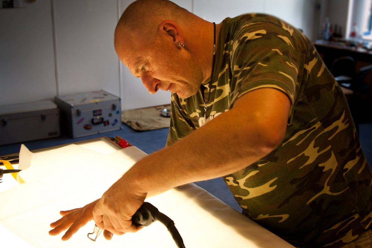 Raphael Schlegel repairing a parachute.