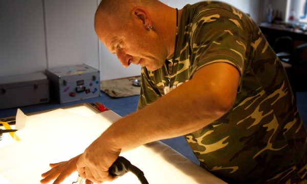 Raphael Schlegel repairing a parachute.