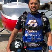 Mario poses in front of the Twin Otter at Skydive City in Zhills, Florida