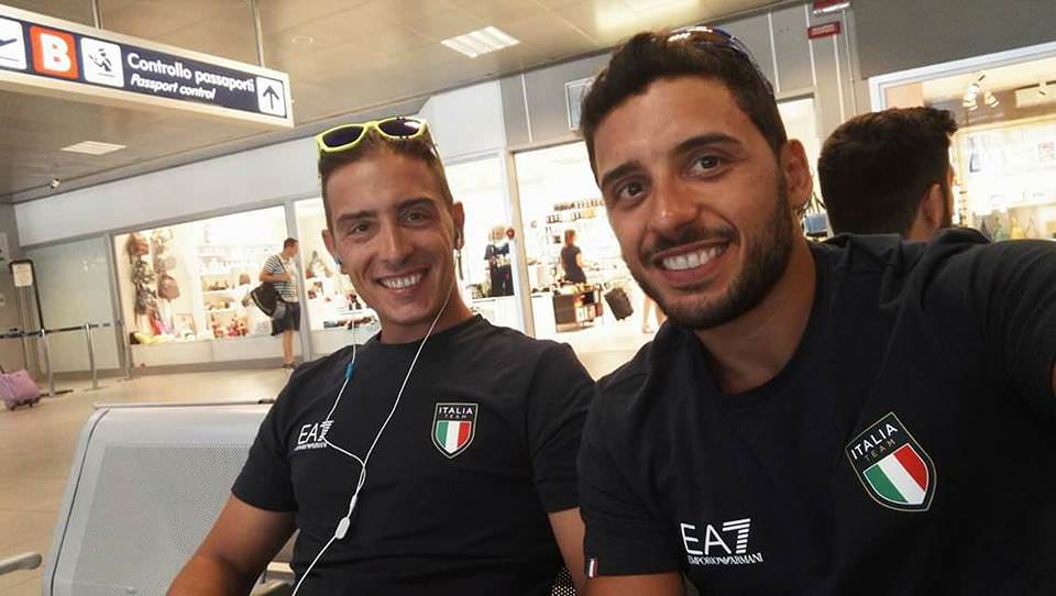 The brothers take a selfie at an airport.