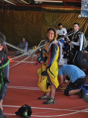 Marine smiles while dropping her gear after a jump