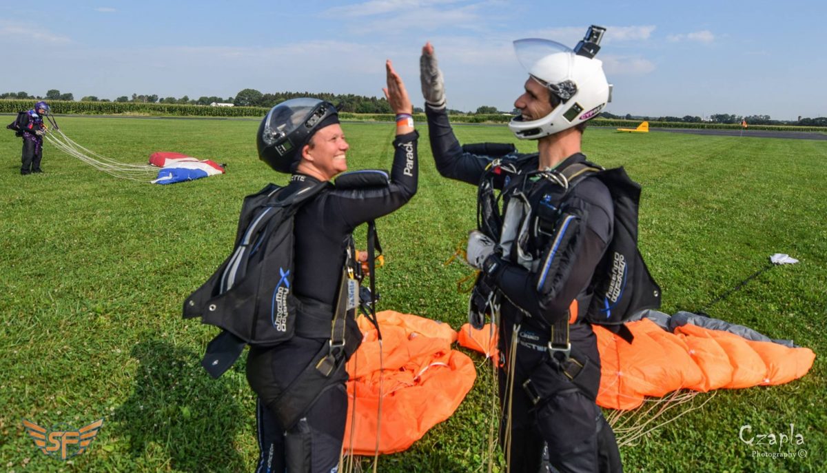 Steve and JaNette give each other a high five in the landing area