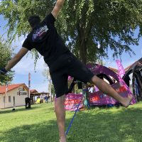 Joel Strickland balancing on a slackline