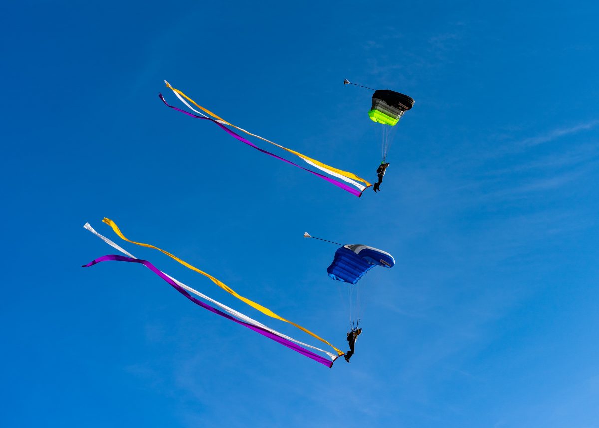 Sara Curtis flies under canopy with streamers