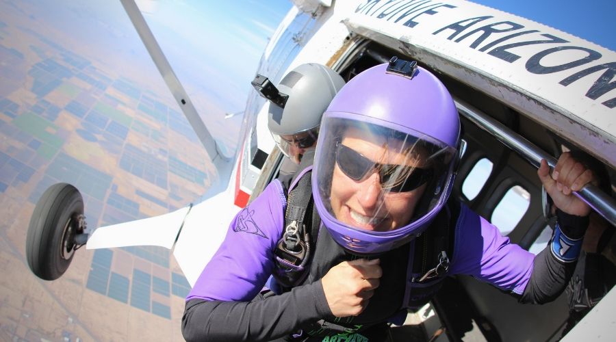 Chazi Blacksher smiles before exiting the Twin Otter