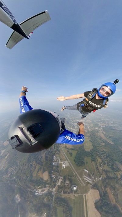 Kaz exiting a Twin Otter for a freefly jump with her husband