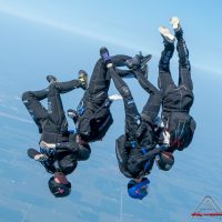 SDC Core flying in a head down orientation thousands of feet in the air above Skydive Chicago