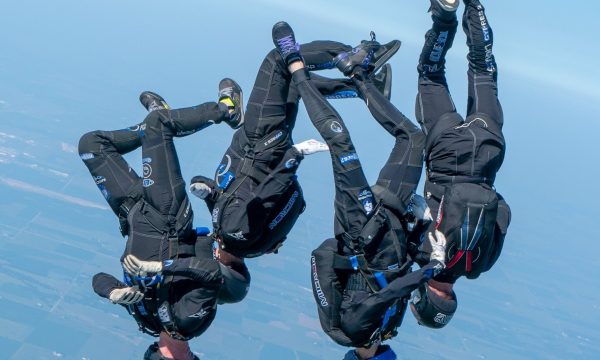 SDC Core flying in a head down orientation thousands of feet in the air above Skydive Chicago