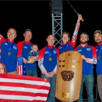 SDC Core smiles as they gather together for a picture on the medal stand wearing their Golf Medals at the 2018 World Championships in Australia.