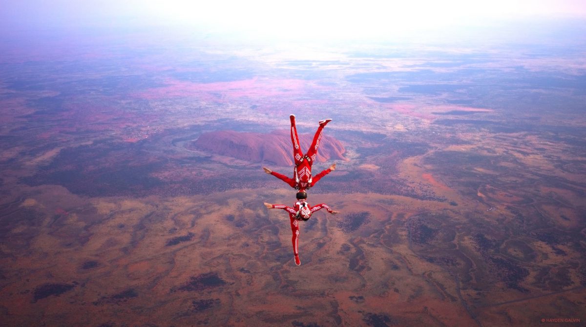 Photo of AirWax above Uluru, Australia with Ayers Rock in the back.