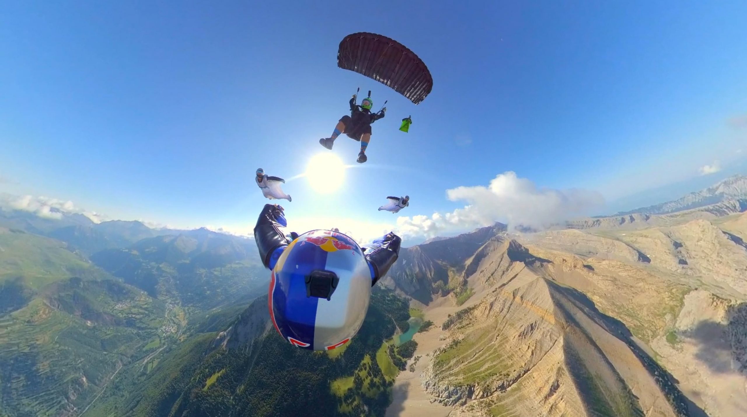 Pete Allum flies his parachute above wingsuiter Dani Roman