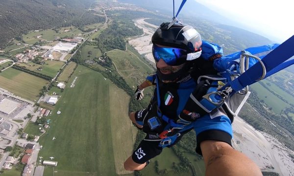 Vito smiles under canopy while getting ready for his final approach under parachute