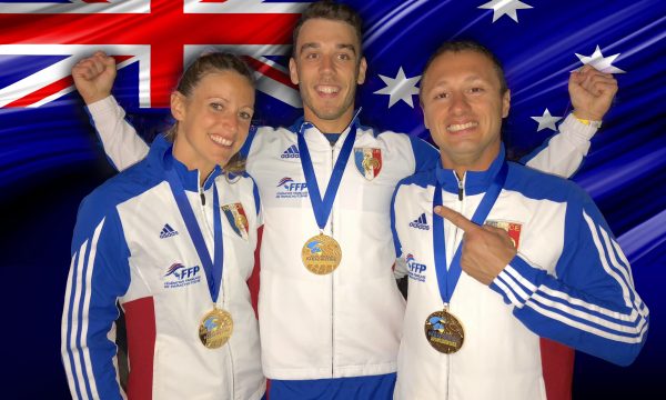 Team Airwax smiles while wearing their gold medals from the World Meet