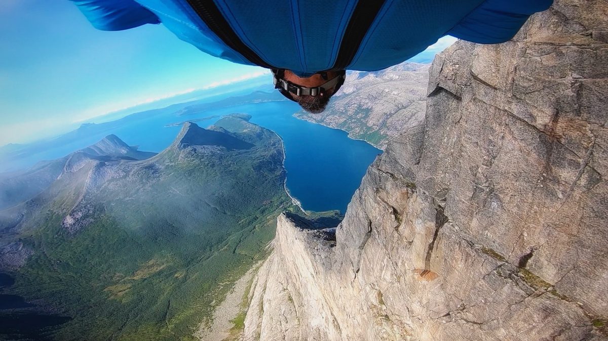 Jason Moledzki flies through the mountains while flying a wingsuit