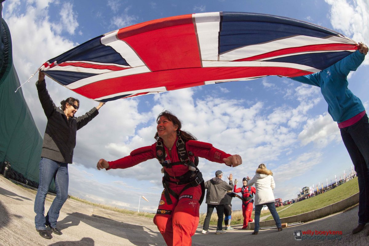 Lesley Gale walks under the Union Jack