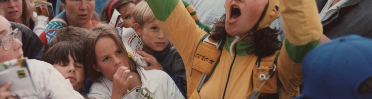 Lesley landing at a demo amongst excited children